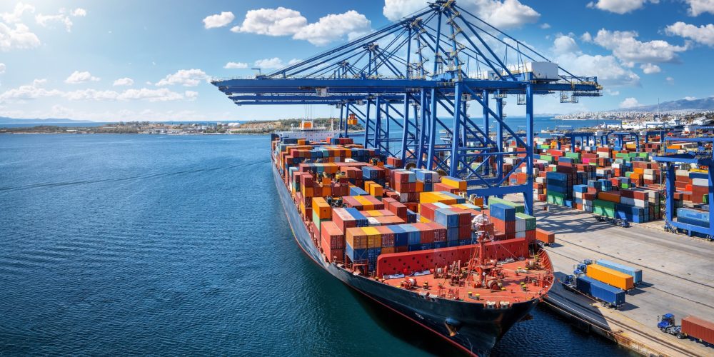 A,Large,Container,Cargo,Vessel,Is,Beeing,Loaded,And,Unloaded